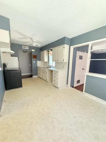 a large white bed in a white room