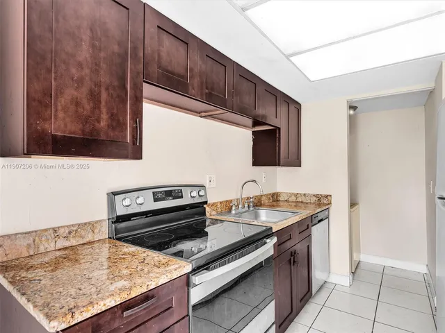 a kitchen with a stove and a microwave