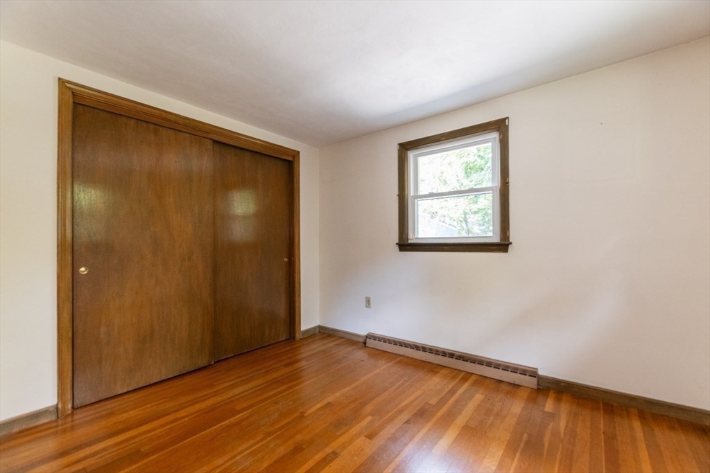 249 Main Street Walpole, MA 02081 - Photo 15 of 31 an empty room with wooden floor and windows
