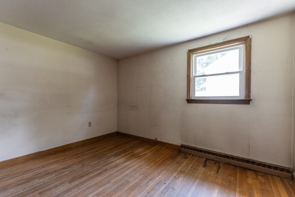 249 Main Street Walpole, MA 02081 - Photo 18 of 31 an empty room with wooden floor and windows