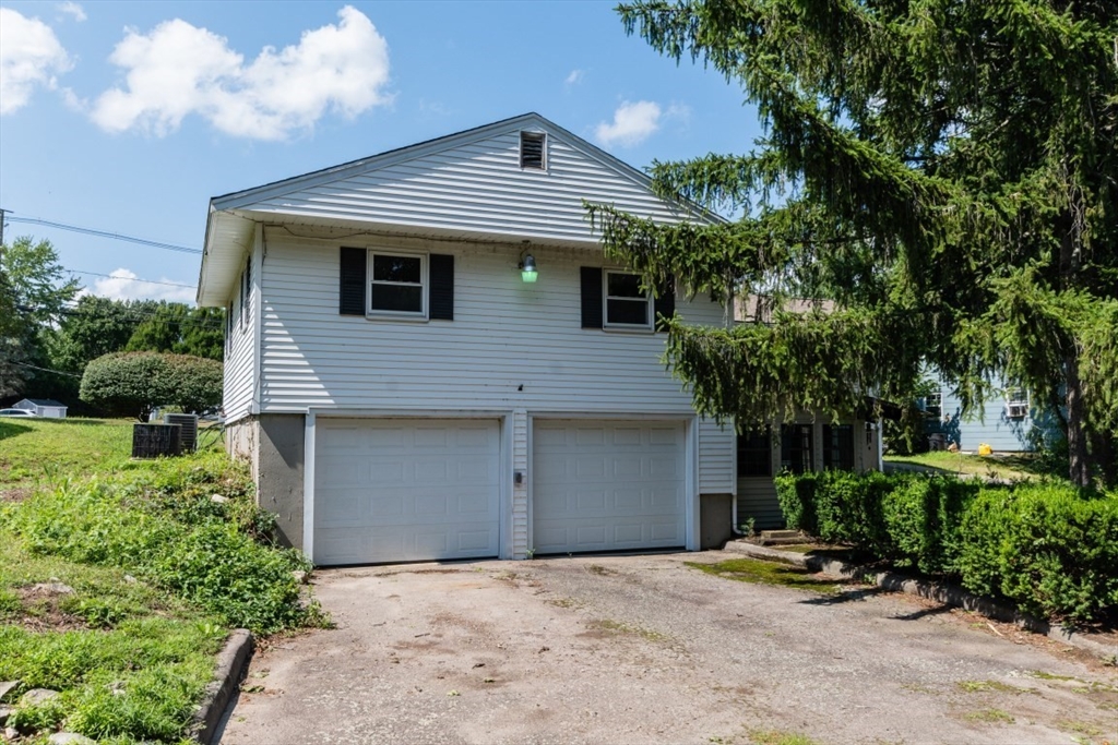 249 Main Street Walpole, MA 02081 - Photo 6 of 31 a front view of a house with a garden