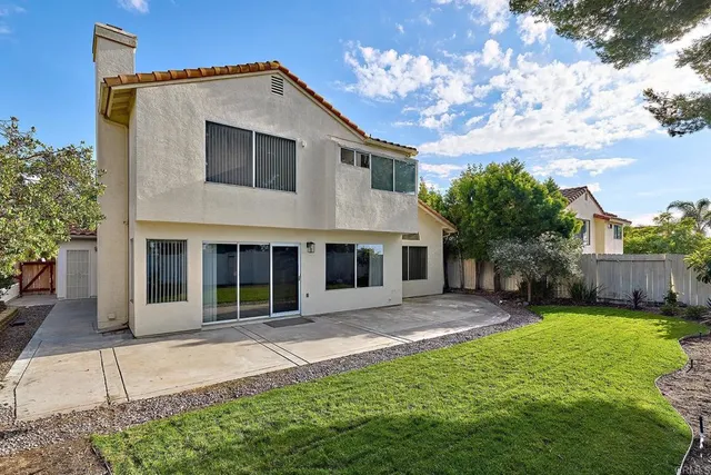 a front view of a house with a yard and porch
