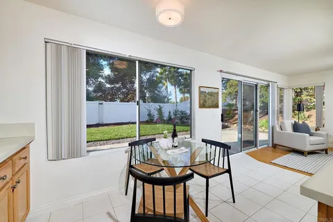 a balcony with furniture and a potted plant