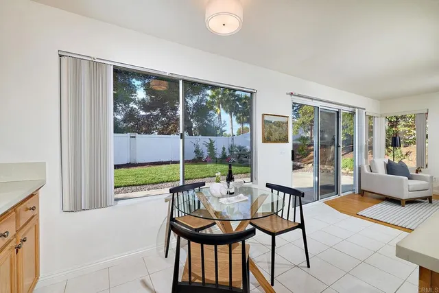 a balcony with furniture and a potted plant
