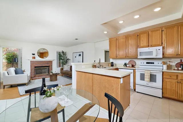a kitchen with cabinets a sink and appliances