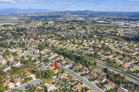 an aerial view of city and mountain