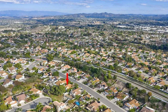 an aerial view of city and mountain