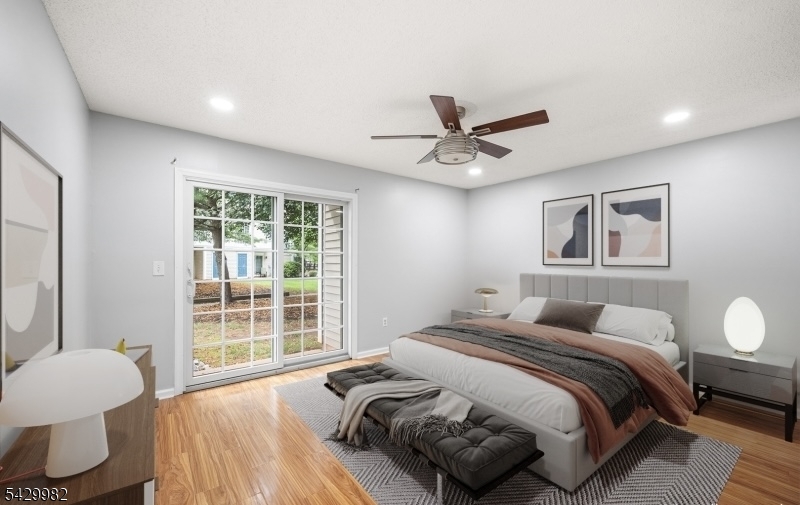 3702 Riddle Court, Unit 2 Bridgewater, NJ 08807 - Photo 12 of 20 a bedroom with a bed and a large window