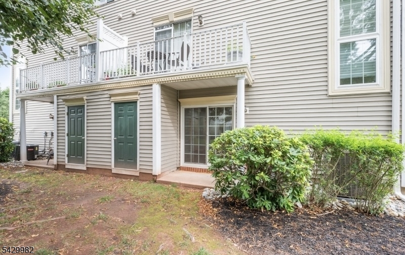 3702 Riddle Court, Unit 2 Bridgewater, NJ 08807 - Photo 20 of 20 a front view of a house with garden