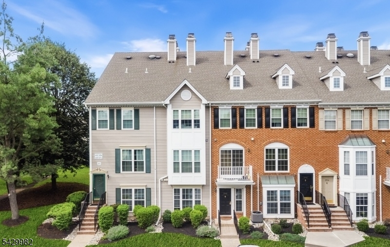 3702 Riddle Court, Unit 2 Bridgewater, NJ 08807 - Photo 2 of 20 a front view of a residential apartment building with a yard