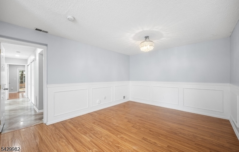 3702 Riddle Court, Unit 2 Bridgewater, NJ 08807 - Photo 5 of 20 wooden floor in an empty room with a window