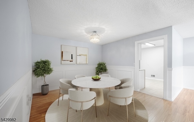 3702 Riddle Court, Unit 2 Bridgewater, NJ 08807 - Photo 6 of 20 a dining room with furniture and potted plant
