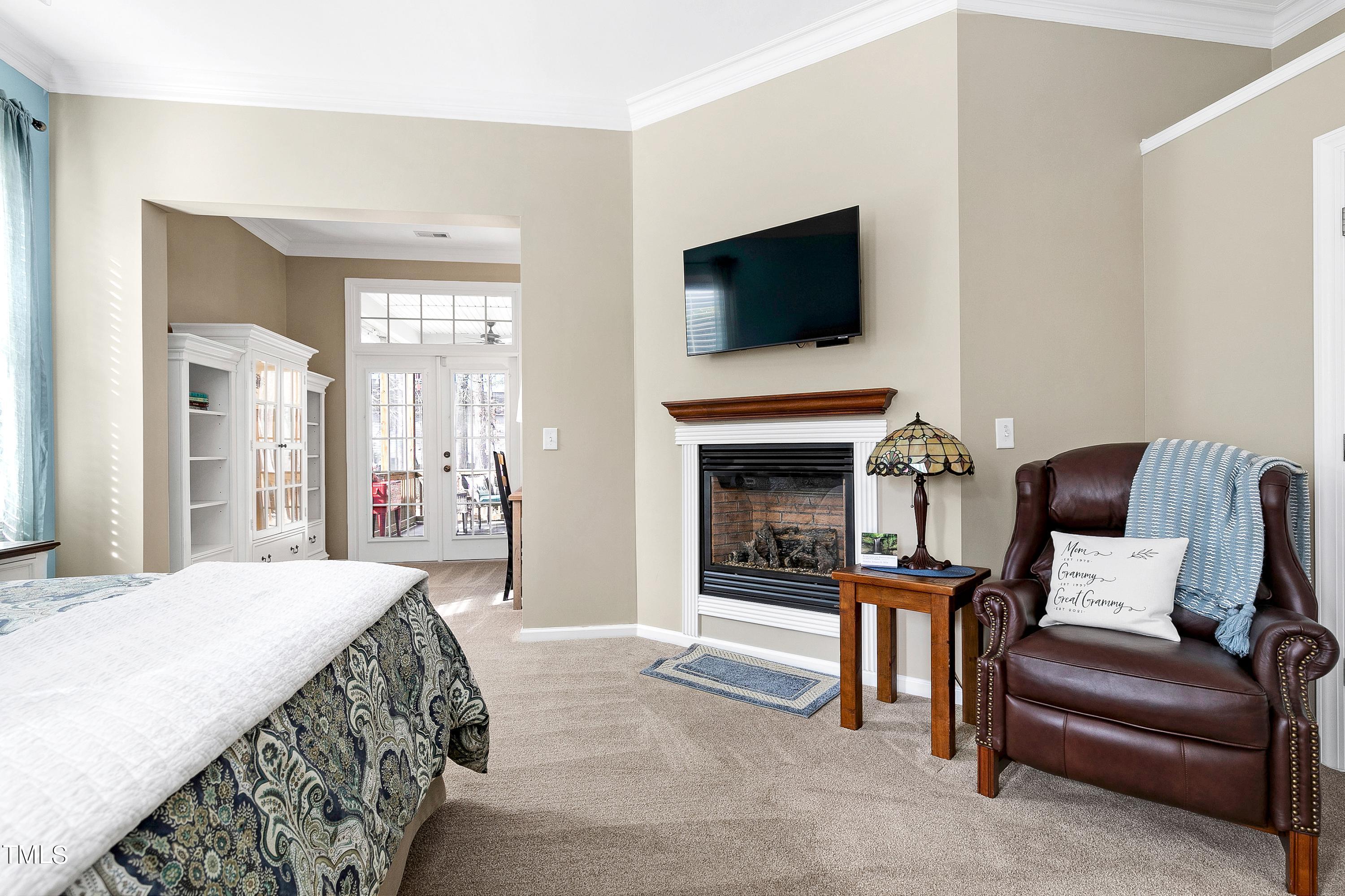 6115 Leesburg Lane Raleigh, NC 27617 - Photo 25 of 46 a spacious bedroom with a bed and a television