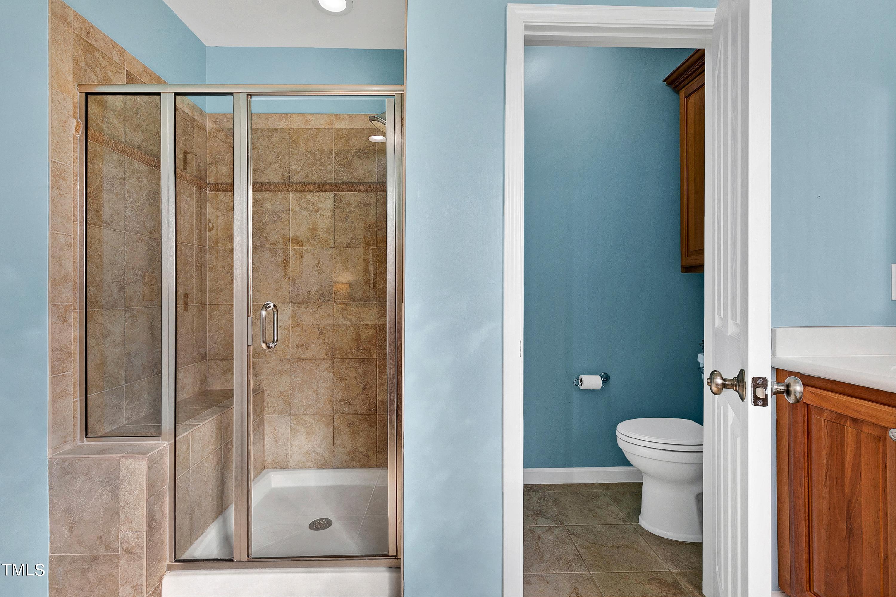 6115 Leesburg Lane Raleigh, NC 27617 - Photo 29 of 46 a bathroom with a shower and a toilet