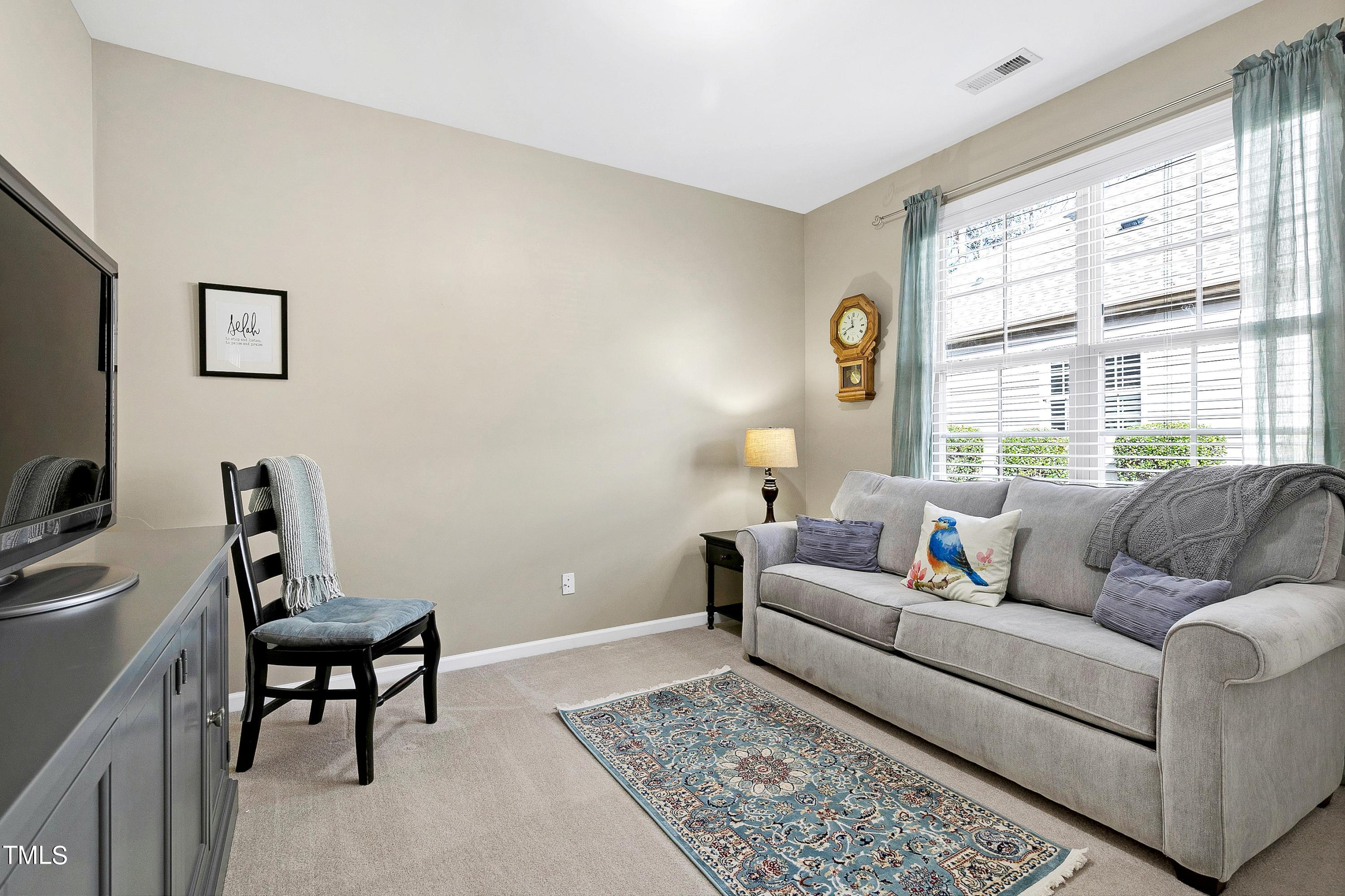 6115 Leesburg Lane Raleigh, NC 27617 - Photo 32 of 46 a living room with furniture and a window