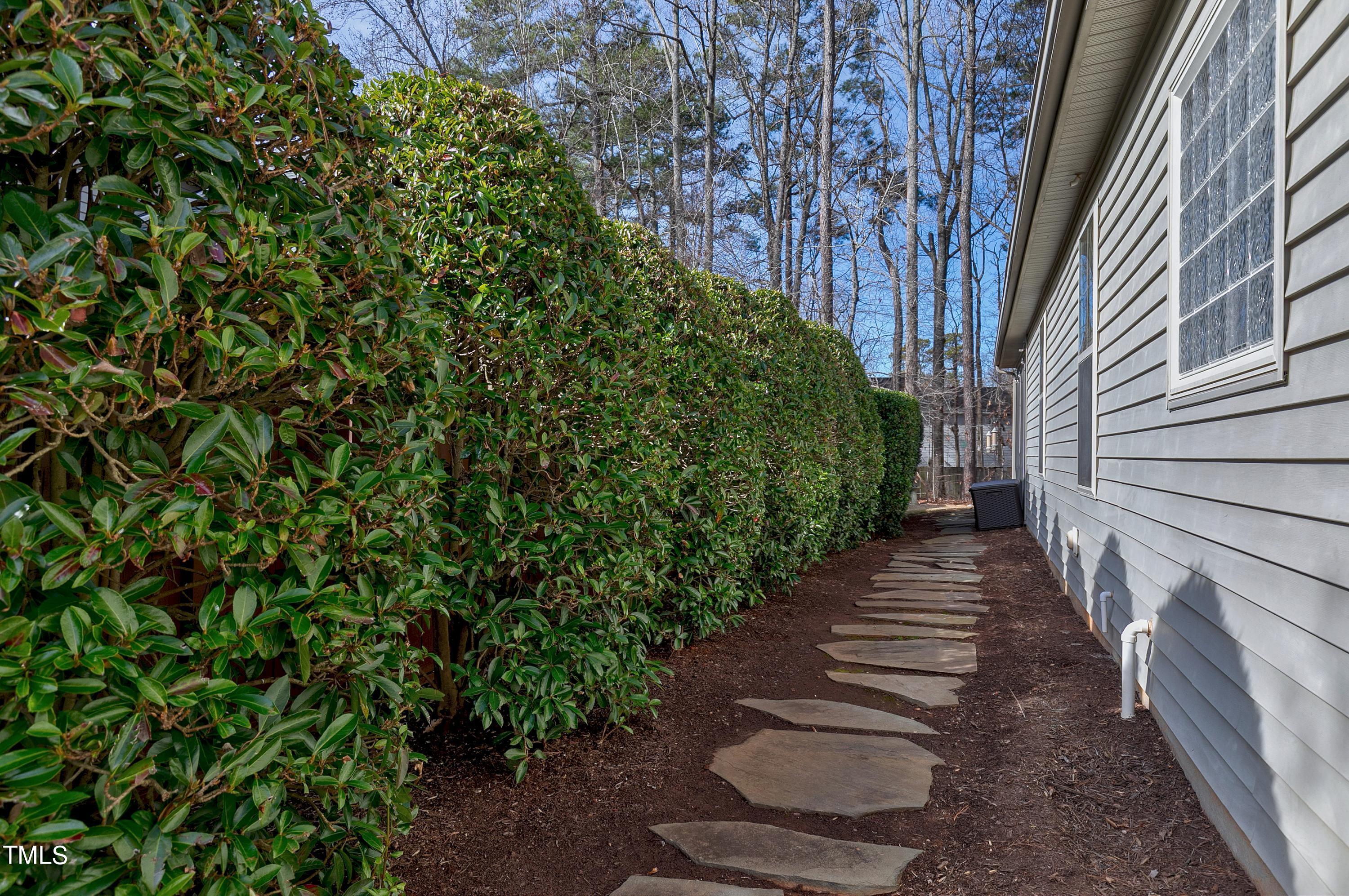 6115 Leesburg Lane Raleigh, NC 27617 - Photo 34 of 46 a view of a pathway of a garden