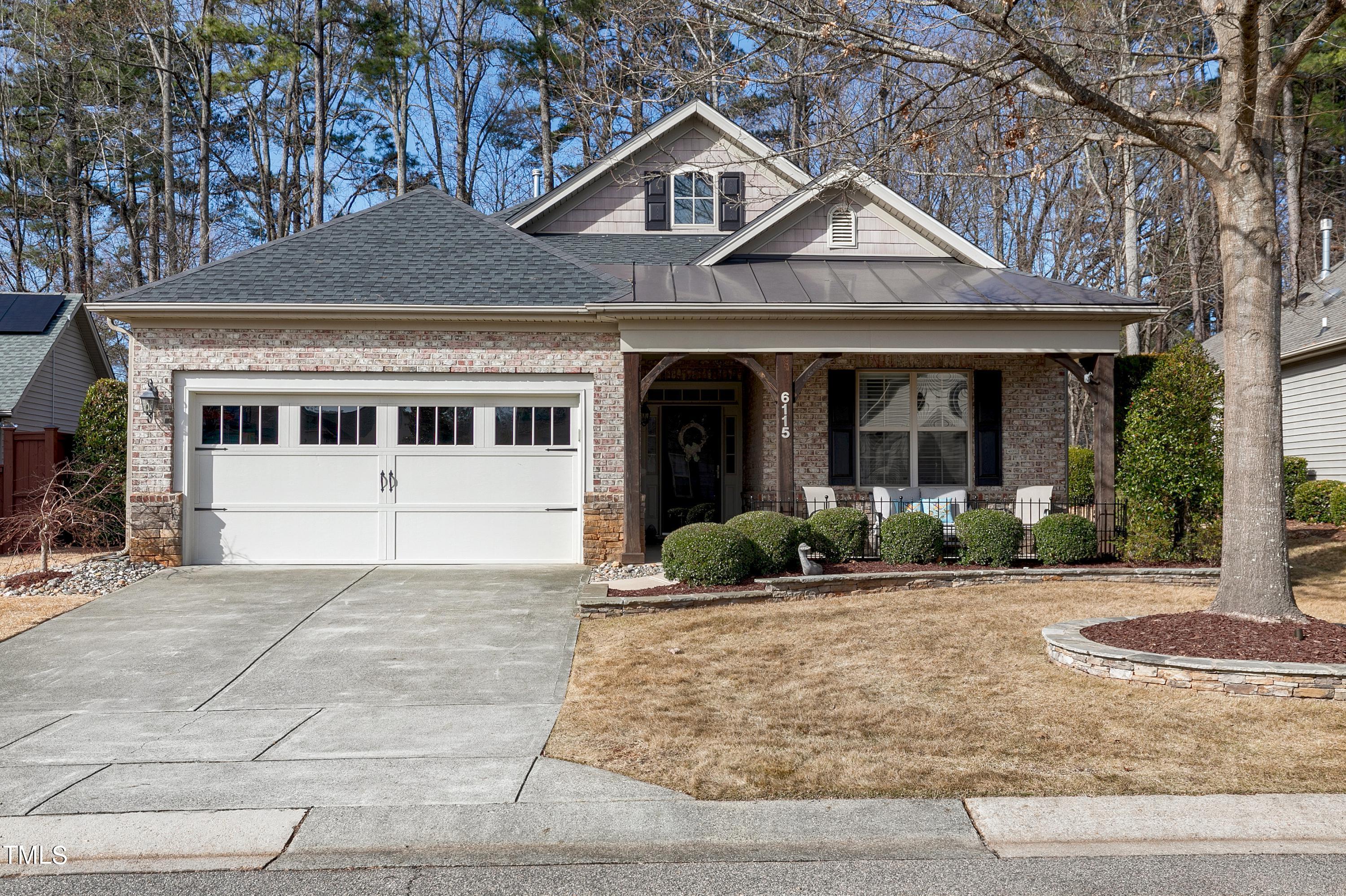 6115 Leesburg Lane Raleigh, NC 27617 - Photo 41 of 46 a front view of a house with a yard