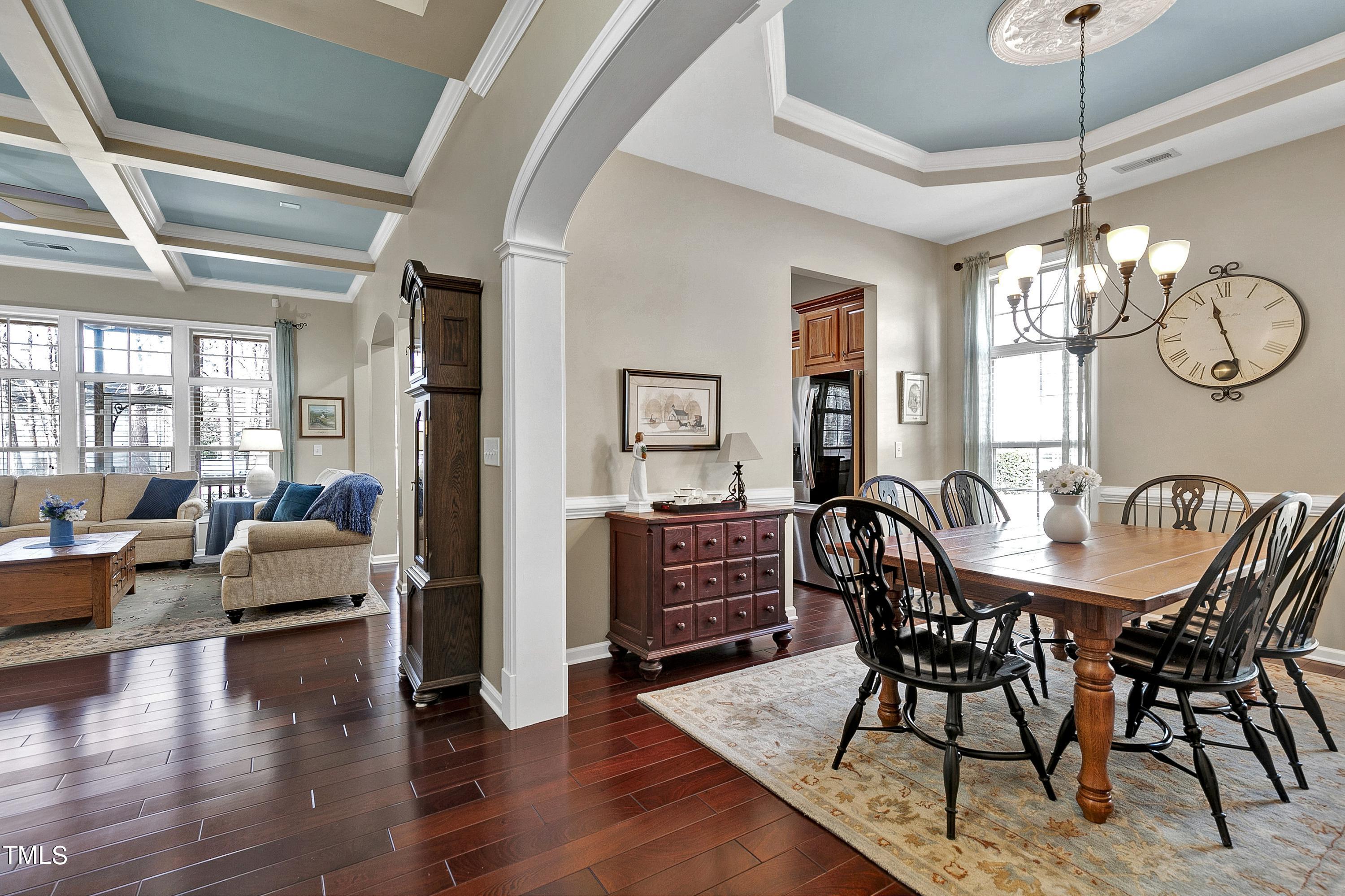 6115 Leesburg Lane Raleigh, NC 27617 - Photo 6 of 46 a view of a dining room with furniture wooden floor and chandelier
