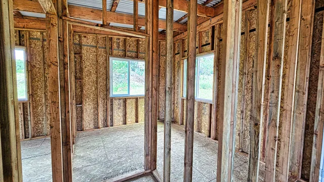 a view of an empty room with a balcony