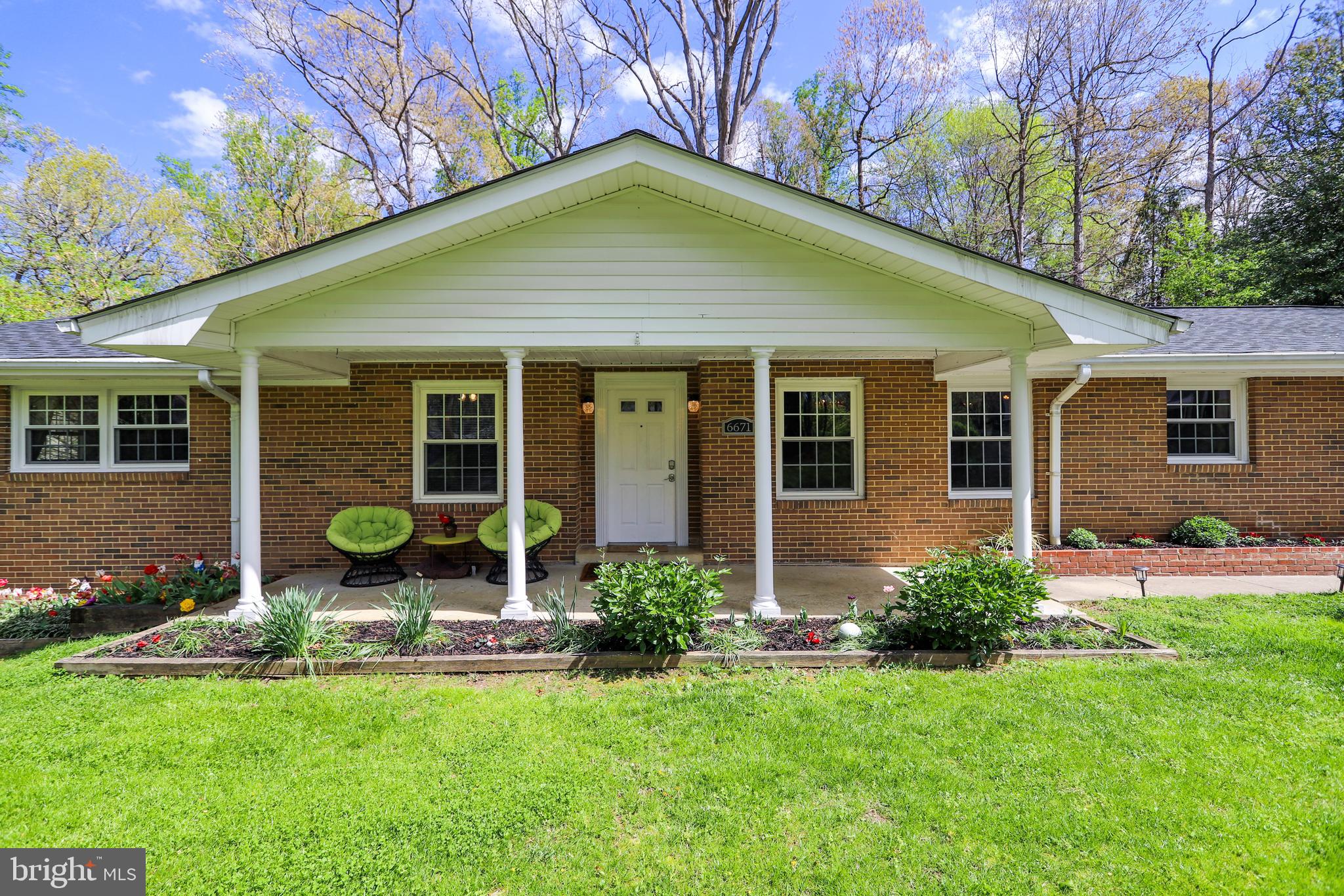 6671 Ridgeway Drive Springfield, VA 22150 - Photo 1 of 53 a house that has a big yard in front of it