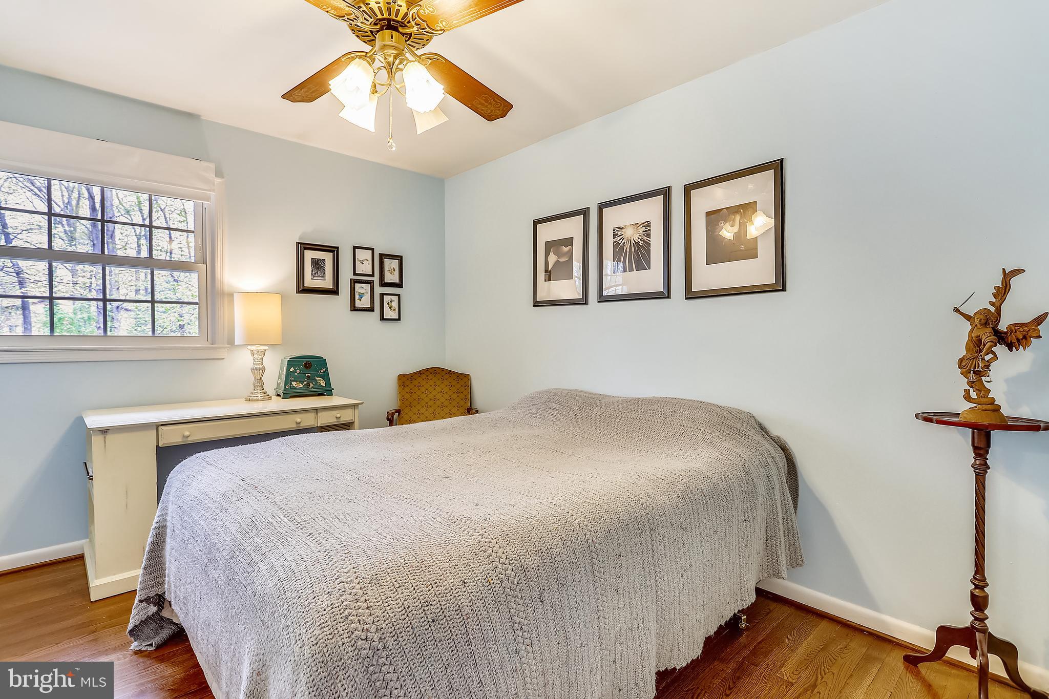 6671 Ridgeway Drive Springfield, VA 22150 - Photo 20 of 53 a bedroom with a bed and a chandelier