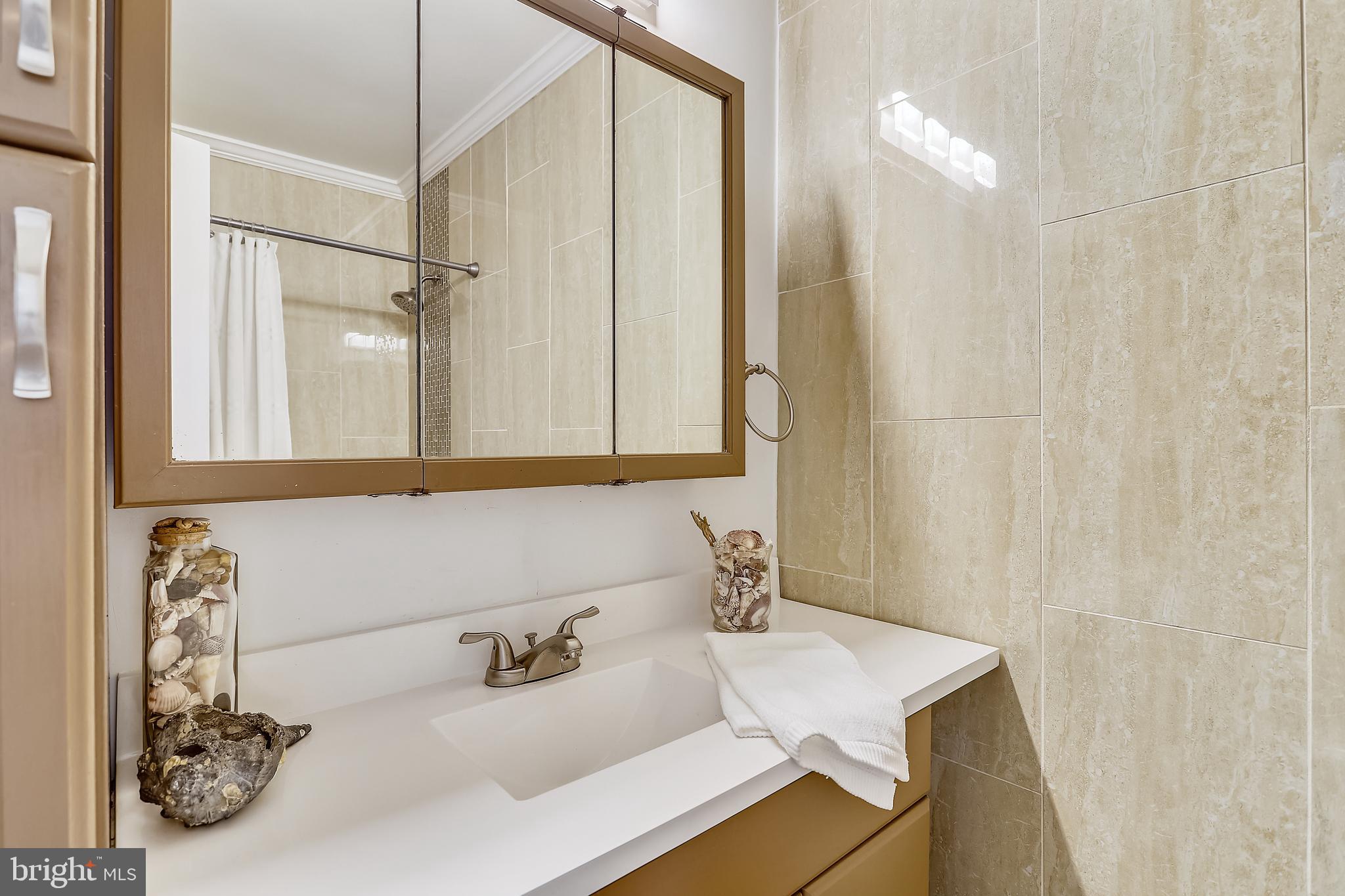 6671 Ridgeway Drive Springfield, VA 22150 - Photo 22 of 53 a bathroom with a sink and a mirror