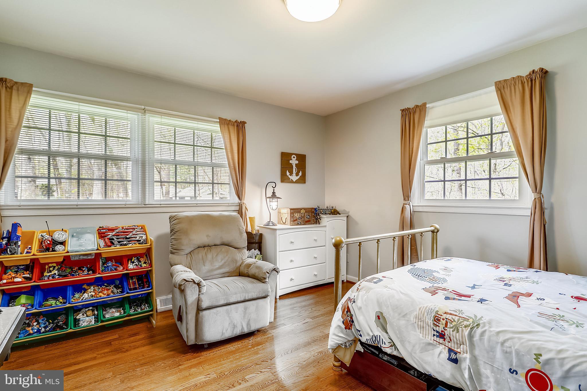 6671 Ridgeway Drive Springfield, VA 22150 - Photo 26 of 53 a bedroom with furniture and a window