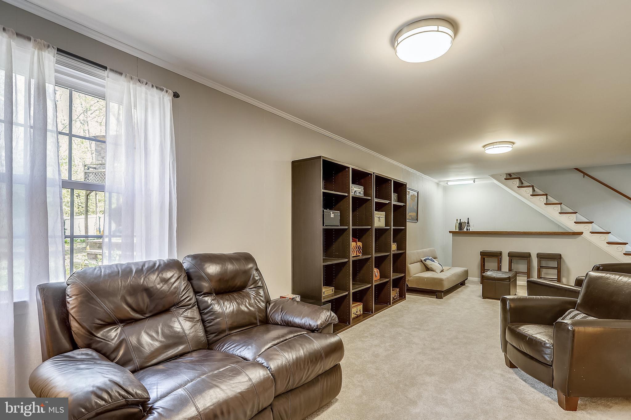 6671 Ridgeway Drive Springfield, VA 22150 - Photo 33 of 53 a living room with furniture and a large window