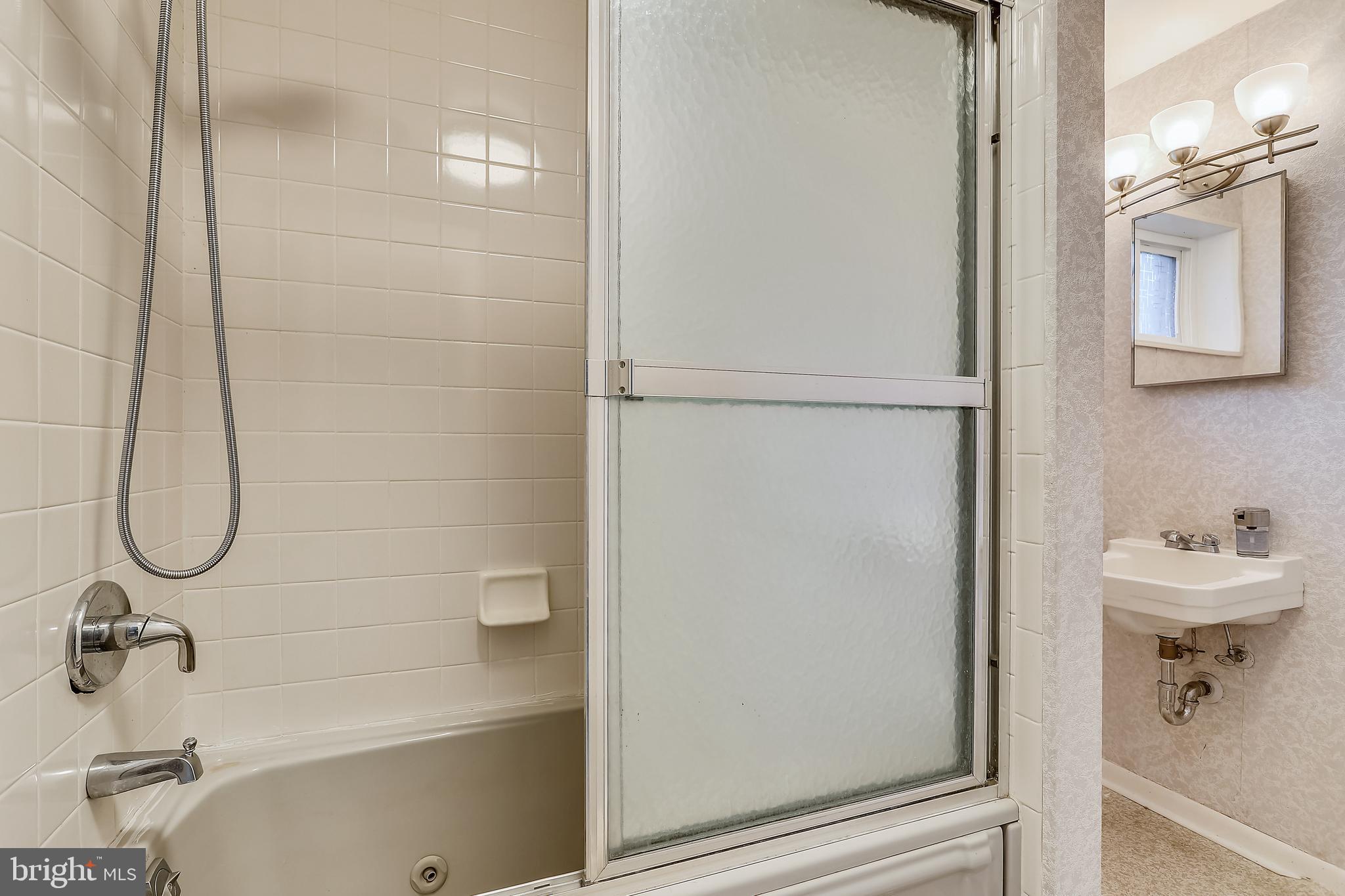 6671 Ridgeway Drive Springfield, VA 22150 - Photo 34 of 53 a bathroom with a bath tub and a sink