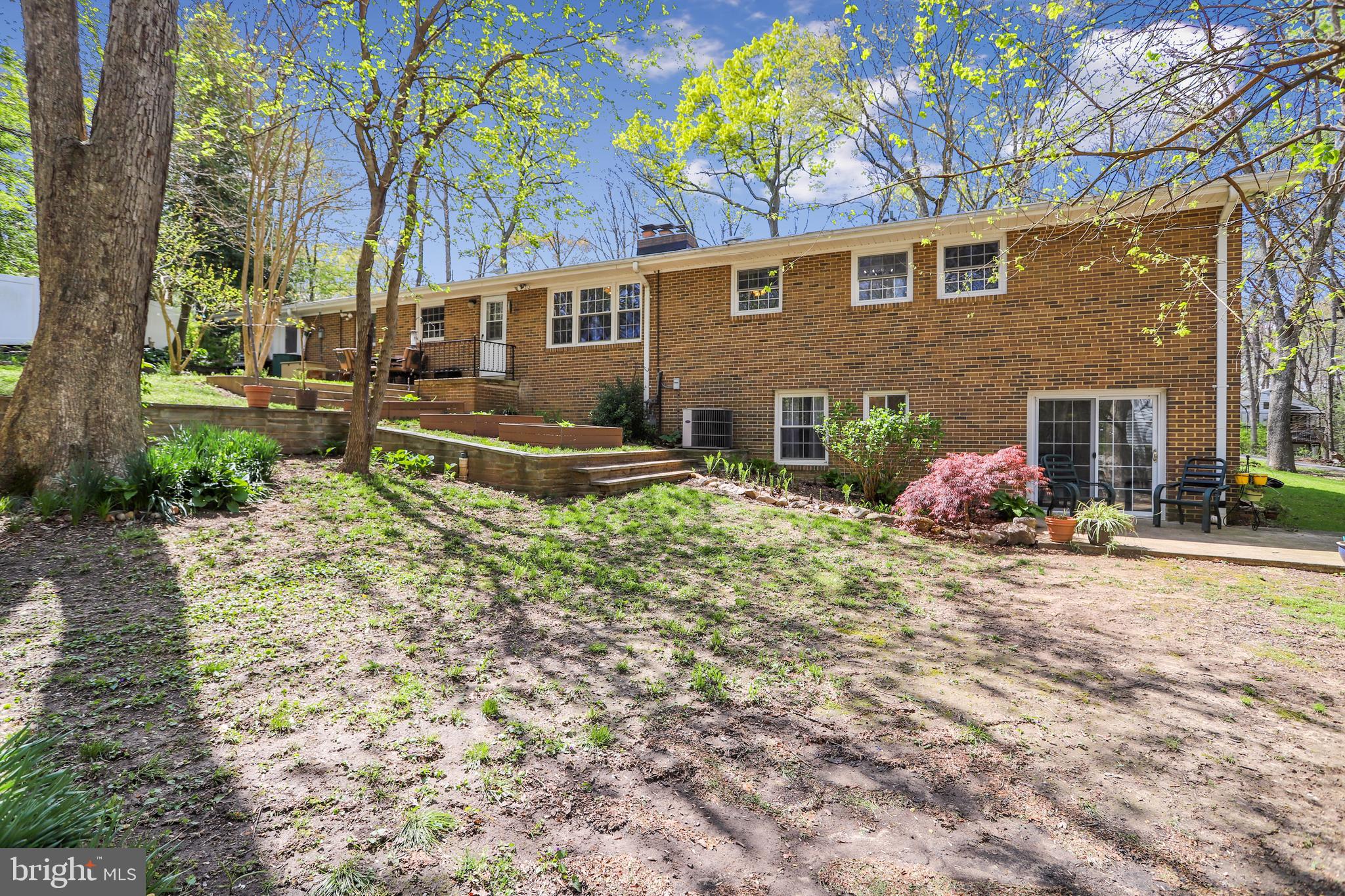 6671 Ridgeway Drive Springfield, VA 22150 - Photo 40 of 53 a view of a house with backyard and a tree
