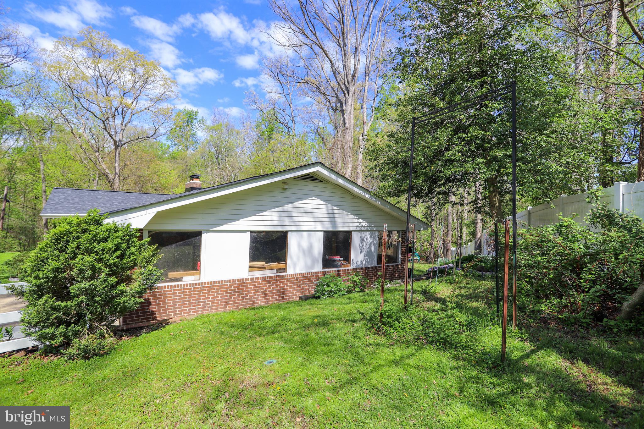 6671 Ridgeway Drive Springfield, VA 22150 - Photo 43 of 53 a front view of house with yard and green space