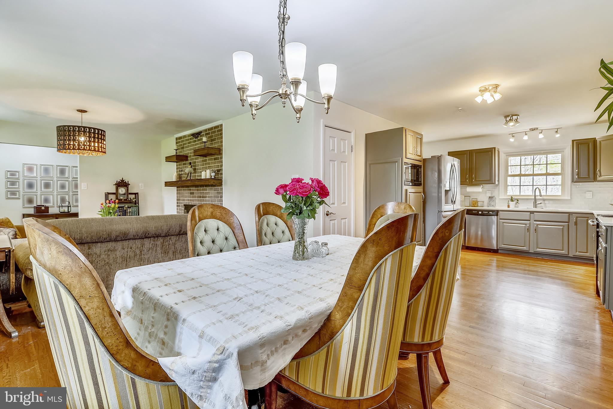 6671 Ridgeway Drive Springfield, VA 22150 - Photo 9 of 53 a view of a dining room with furniture and wooden floor
