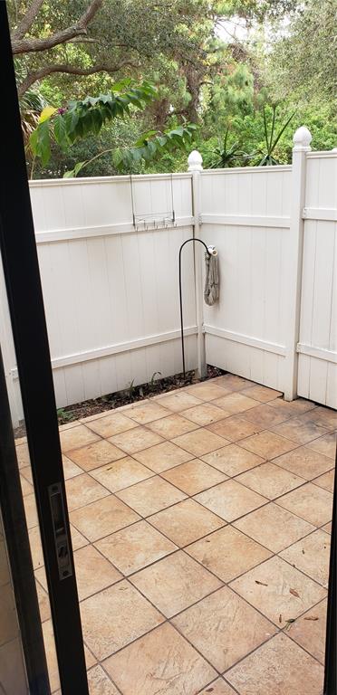 2052 Kings Highway, Unit 7 Clearwater, FL 33755 - Photo 11 of 16 a white house with a outdoor space