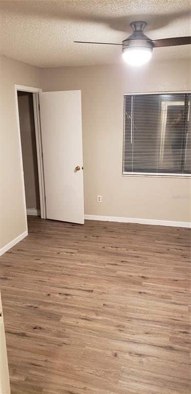 2052 Kings Highway, Unit 7 Clearwater, FL 33755 - Photo 13 of 16 a view of an empty room with wooden floor