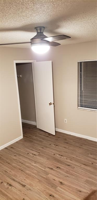 2052 Kings Highway, Unit 7 Clearwater, FL 33755 - Photo 15 of 16 a view of an empty room with wooden floor