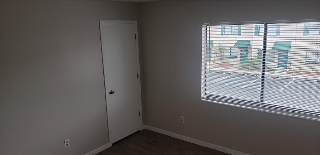 2052 Kings Highway, Unit 7 Clearwater, FL 33755 - Photo 16 of 16 a view of an empty room with a window