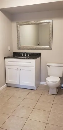 a bathroom with a toilet and a sink