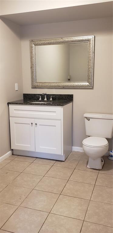 2052 Kings Highway, Unit 7 Clearwater, FL 33755 - Photo 8 of 16 a bathroom with a toilet and a sink
