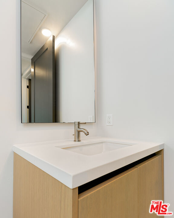 3833 Dunn Drive, Unit PH2 Culver City, CA 90232 - Photo 11 of 19 a bathroom with a sink and a mirror