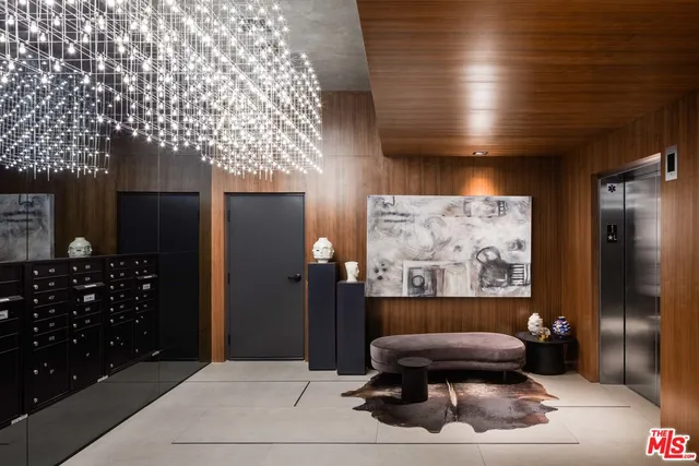 a living room with a couch and a bookshelf