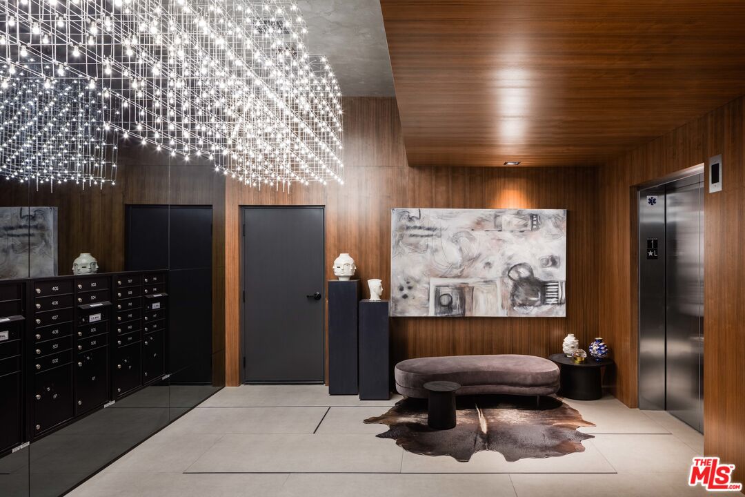 3833 Dunn Drive, Unit PH2 Culver City, CA 90232 - Photo 15 of 19 a living room with a couch and a bookshelf