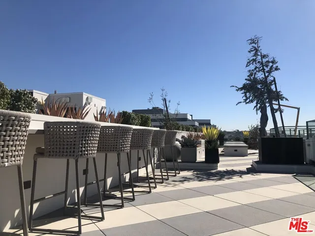 a view of a terrace with sitting area