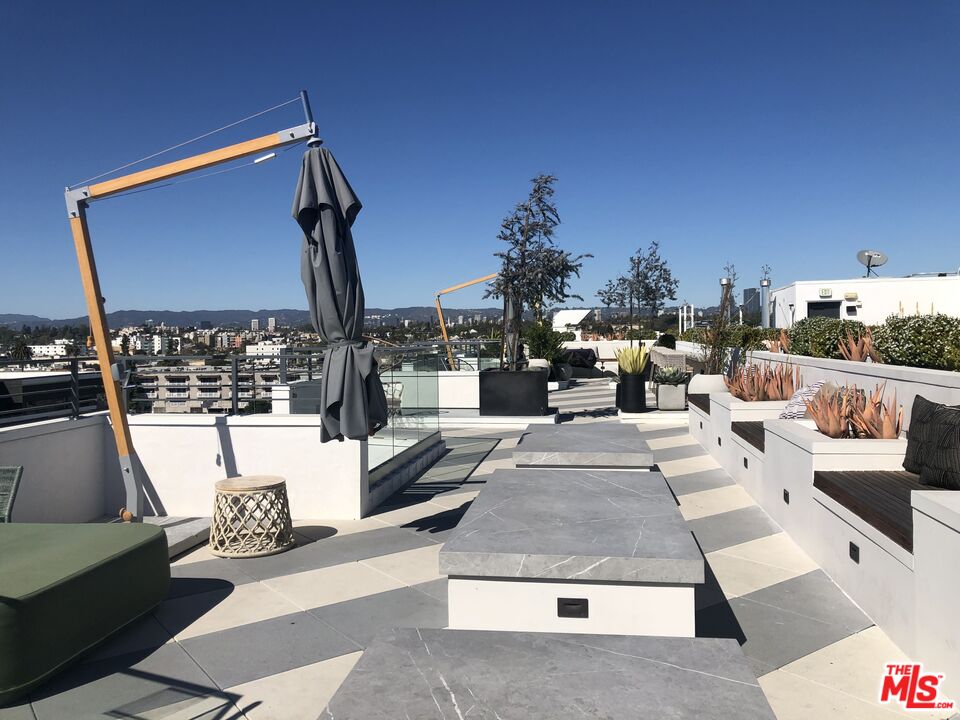 3833 Dunn Drive, Unit PH2 Culver City, CA 90232 - Photo 18 of 19 a view of living room with patio furniture and a potted plant