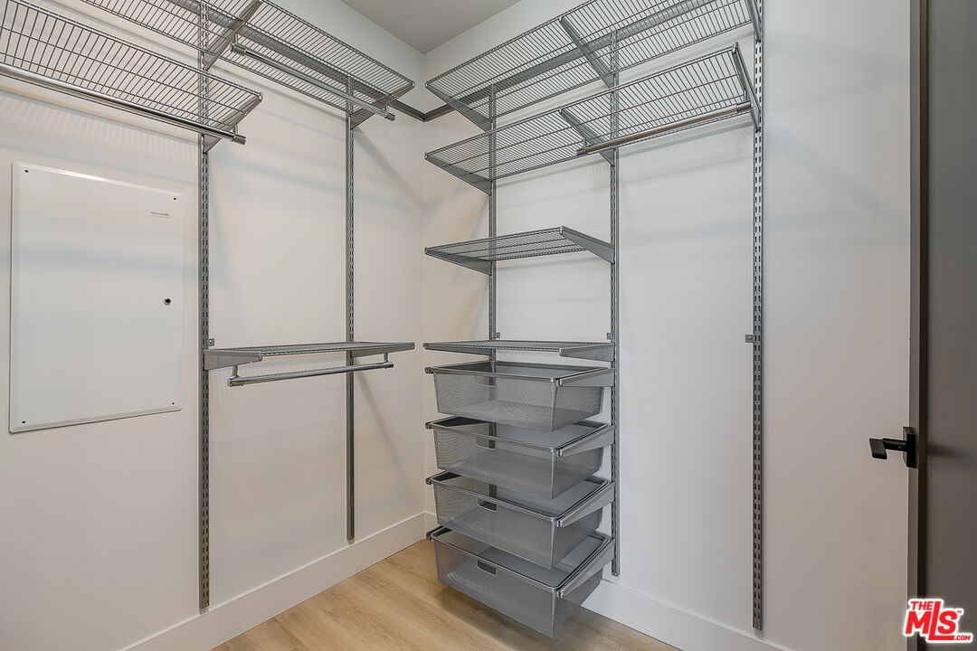 3833 Dunn Drive, Unit PH2 Culver City, CA 90232 - Photo 6 of 19 a view of a room with racks on the wall