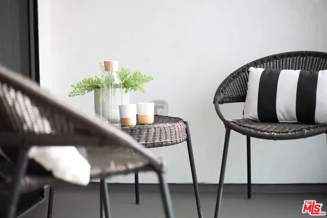 a view of balcony with furniture