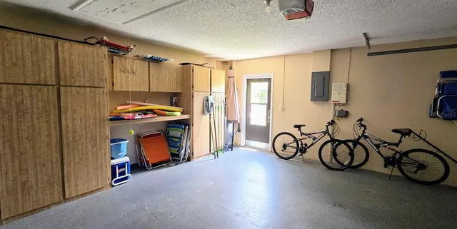 a view of an entryway with a fridge