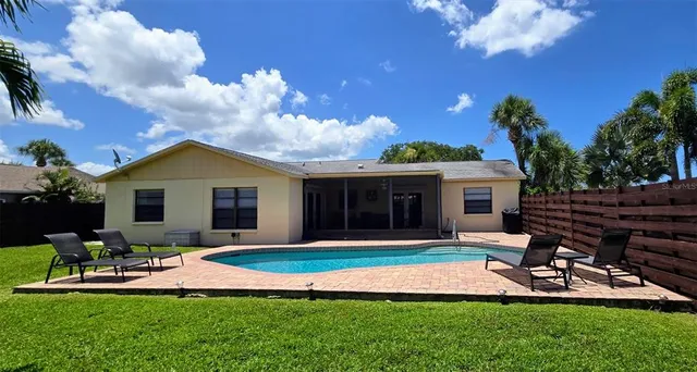 a front view of house with a garden and patio
