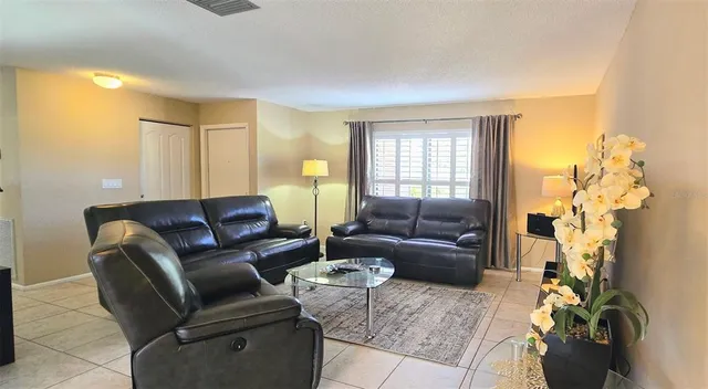 a living room with furniture and a couch