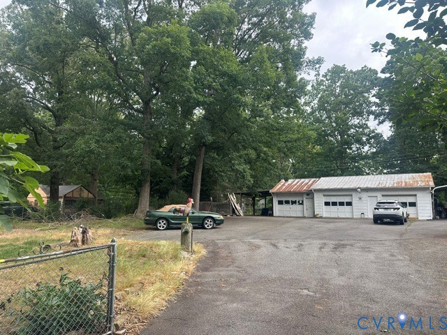9808 Reams Road North Chesterfield, VA 23236 - Photo 2 of 8 a view of a house with pool and a yard