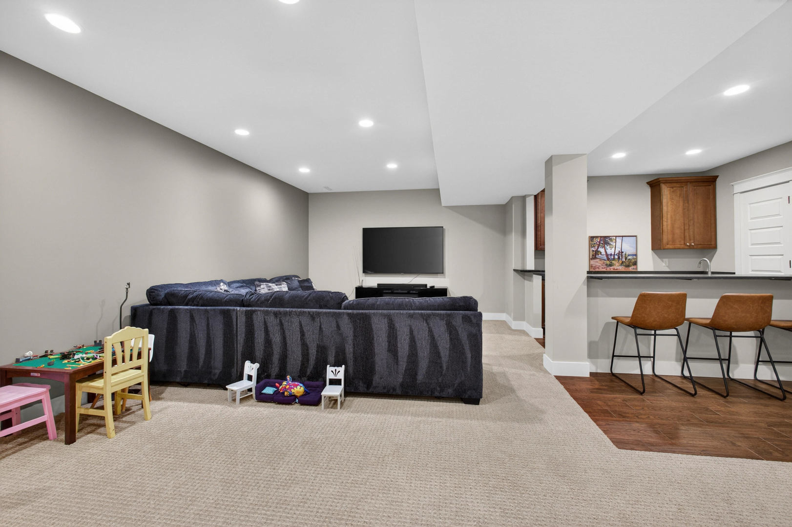 5700 Emily Road Bettendorf, IA 52722 - Photo 42 of 58 a living room with furniture and a flat screen tv